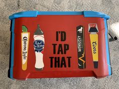 a red and blue cooler with writing on the side that says i'd tap that