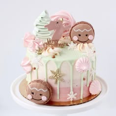 there is a cake decorated with pink and green icing