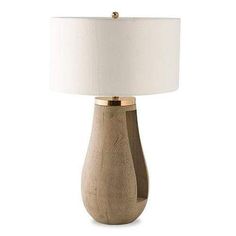 a wooden table lamp with a white shade