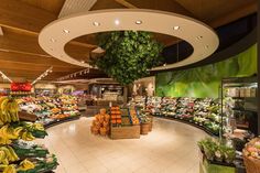 the inside of a grocery store filled with lots of fresh fruits and veggies