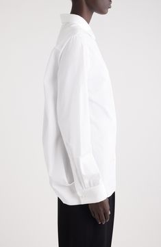 A dramatically split back carves this crisp cotton shirt that's tailored in an oversized silhouette and has voluminous lantern sleeves. 27" front length; 6" back length (size 36FR) Front button closure Point collar Long sleeves with button cuffs 100% cotton Dry clean Made in Italy Designer Clothing Classic Oversized Blouse, Oversized Modern Formal Blouse, Oversized Classic Blouse, Elegant Oversized Business Shirt, Modern Oversized Formal Blouse, Elegant Oversized Shirt For Business, Timeless Long Sleeve Dress Shirt For Daywear, Classic Oversized Business Shirt, Formal Oversized Shirt With Button Cuffs