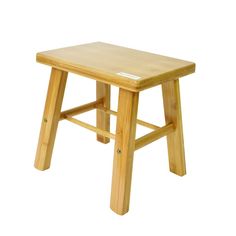 a small wooden stool on a white background