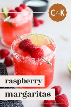 raspberry margaritas with lime and garnish on the rim, served in glasses