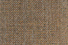 an orange and grey tweed fabric textured with small dots, closeup view from above