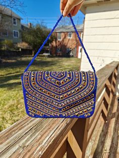 Handmade Blue Clutch Purse, Beaded Clutch Purse, Party Golden Purse, Blue Clutch, Glass Beaded Bag, Blue Beaded Handbag, Blue Box Bag, Blue Crossbody Bag The purse clutch is handmade and adorned with rhinestones and bead embroidery. This purse is stylish, flashy, and has a dazzled look. These purses/bags are for wedding functions, parties, and formal events, or you can use them as casual. These are fancy small bags ideal for money, cards, and makeup touchup kits. The bag has a single compartment Handmade Blue Shoulder Bag For Festivals, Blue Beaded Evening Bag For Party, Blue Rectangular Festival Bag, Blue Rectangular Shoulder Bag For Festivals, Bohemian Beaded Rectangular Evening Bag, Beaded Pouch Shoulder Bag For Festive Occasions, Blue Beaded Clutch Bag, Festive Beaded Pouch Shoulder Bag, Blue Embroidered Bag For Festivals