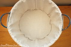 an empty chair cushion on top of a wooden table