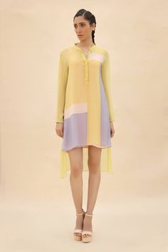 Buy Yellow Chiffon Mandarin Collar Colorblock Tunic For Women by Abhishek Sharma Online at Aza Fashions. Spring Blouse With Patchwork And Asymmetrical Hem, Spring Patchwork Blouse With Asymmetrical Hem, Chic Blouse With Curved Hem For Spring, Chic Spring Blouse With Curved Hem, Spring Patchwork Dresses For Layering, Spring Workwear Blouse With High-low Hem, Spring Workwear Blouse With Color Block, Yellow Long Sleeve Tunic For Spring, Spring Workwear Tunic With Shirttail Hem