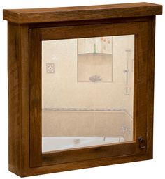 the reflection of a bathtub and sink in a wooden framed wall mounted medicine cabinet