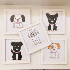 four framed pictures of dogs on the wall