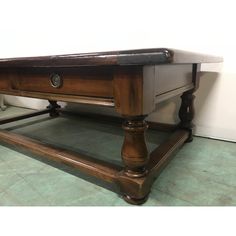 an old style pool table with two drawers