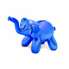 an elephant shaped toy sitting on the ground