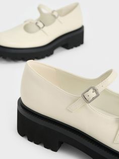 White shoes can also look edgy, and these Mary Janes in chalk demonstrate that. The classic Mary Jane style has been reimagined with more maximalist features, including double adjustable straps and nostalgic T-bars that make them stand out. Contrasting the bright chalk finish with black chunky soles, the result is a striking two-toned look that is still versatile enough to go with most outfits. Complete with ridges on the soles for better traction and grip, these sturdy Mary Janes are set to become your favourite footwear this season and beyond. Chunky Mary Janes, Faux Leather Heels, Charles Keith, White Shoes, Mary Janes, Chalk, Adjustable Straps, Heel Height, Loafers