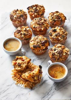 muffins and cups of coffee on a marble table