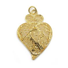 Features The Viana's Heart was created as a symbol of devotion to the Most Sacred Heart of Jesus, but soon became an iconical and emotional heritage of Portugal and of the Portuguese art of filigree. Filigree imitation gold pendent, lacy, to be worn with the Traditional Women's costumes To Clean Do Not Use Abrasive Products; Gold in Color, Not Real Gold Used By The Traditional Portuguese Women Folklore Dancers Measurements: 2" x 1.25" Inch Manufacturing Process Portuguese filigree is the result Traditional Heart-shaped Jewelry For Festive Occasions, Valentine's Day Gold Necklace With Intricate Design, Ornate Heart-shaped Jewelry With Intricate Design, Traditional Heart-shaped Yellow Gold Jewelry, Ornate Gold Heart Pendant Necklace, Gold Intricate Design Heart Pendant Jewelry, Gold Heart Pendant With Intricate Design, Ornate Filigree Jewelry For Valentine's Day, Traditional Heart Charm Jewelry For Valentine's Day