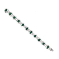 A beautiful emerald and diamond platinum bracelet. Stunning oval cut green emeralds 11.82 ct in total. Accented by white natural diamonds 10.77 ct in total. Diamonds are all natural in G-H Color Clarity VS. Platinum 950. This a stunning, timeless, classic bracelet perfect for all special occasions. Length: 18.9 cm Width. 1.2 cm Weight: 48.6 g [shortcode] [video] [/video] [/shortcode] Luxury Green Oval Tennis Bracelet, Oval Green Diamond Bracelets, Green Oval Diamond Bracelets, Green Oval Diamond Tennis Bracelet, Platinum Bracelet, Platinum Earrings, Classic Bracelets, 18k Gold Jewelry, Zambian Emerald