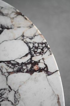 a marble table top with white and brown designs