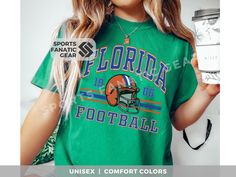 Show off your love and support for Florida football in this trendy, unisex Comfort Colors brand tshirt 🏈. This vintage 80s retro style tee is sure to become your new favorite fan wear or the perfect gift for the football fans in your life!  🏈 To ensure you love your tee and receive asap... 🏈 check size chart in listing photos 🏈 double check your address 🏈 scroll down to see FAQs ✨ STYLE & FIT ✨ Garment-dyed t-shirt made 100% with ring-spun cotton. The soft-washed, garment-dyed fabric brings extra coziness to your wardrobe while the relaxed fit makes it an excellent daily choice. The double-needle stitching throughout the tee makes it highly durable while the lack of side-seams helps the shirt retain its tubular shape. .: 100% ring-spun cotton .: Medium fabric (6.1 oz/yd² (206.8 g/m²) Sports Fan Graphic Print T-shirt For College, Vintage Graphic Print T-shirt For Game Day, Retro College Football Season T-shirt, Cotton College Fan Apparel T-shirt, Retro Game Day T-shirt For Football Season, Alumni Gifts, Florida Football, College Shirts, 80s Retro