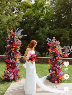 a woman in a wedding dress standing next to two colorful flower archways with flowers on them