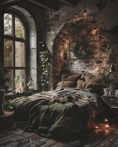 a bedroom with brick walls and lots of lights on the windowsill, bed in foreground