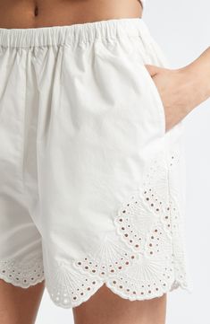 The fashion house's signature blend of minimalism and romance shines through the fresh cotton eyelet and sweetly scalloped edges of these sun-ready shorts. 3 1/2" inseam; 24" leg opening; 12" front rise; 15" back rise Elastic cuffs 100% cotton Hand wash, line dry Imported Designer Clothing This brand has B Corp certification, representing business practices with emphasis on social and environmental performance, accountability and transparency This brand meets Nordstrom Responsible Brands criteri Spring Broderie Anglaise Bottoms For Daywear, White Bottoms With Cutwork Hem For Spring, Spring Cotton Bottoms With Broderie Anglaise, White Bottoms With Cutwork Hem For Summer, White Cotton Bottoms With Eyelet Details, Eyelet Shorts, Summer Wardrobe Essentials, Wedding Guest Shoes, Sports Blazer