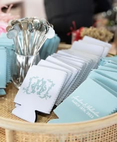 a table topped with blue napkins and silverware