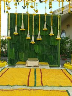 an outdoor stage decorated with yellow and green decorations