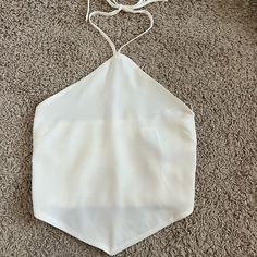 - Never Worn Before!! - Bought It And Did Not Fit - This Top Is Super Cute And Perfect For The Summer! White Halter Neck Top With Tie Back, White Stretch Top With Tie Back, White Fitted Halter Top With Tie Back, Fitted Cream Halter Neck Top, Summer Halter Top With Built-in Bra And Adjustable Fit, White Summer Halter Top, Bra Friendly, White Cami Halter Top With Built-in Bra, Spring Beach Halter Top With Built-in Bra, Cotton Halter Top With Built-in Bra For Beach