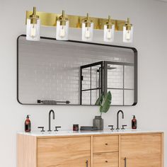 a bathroom with two sinks and a large mirror over it's counter top,