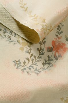 the fabric has been stitched together with flowers on it