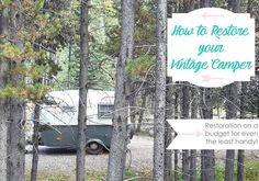 a camper parked in the woods next to trees with text overlay reading how to restore your vintage camper restoration on a budget for even the less money