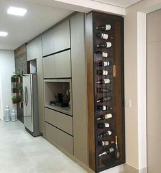 a wine rack in the middle of a kitchen