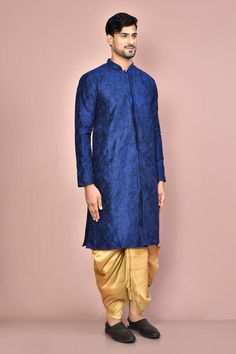 Navy blue cotton kurta with all over floral jaal pattern, mandarin collar and tonal thread embroidery. Paired with dark beige pleated cowl draped dhoti pants.
Components: 2
Pattern: Embroidered
Type Of Work: Thread Work
Neckline: Mandarin Collar
Sleeve Type: Full Sleeves
Fabric: Cotton
Color: Blue
Other Details: 
Front potli buttons
Front and side slits on kurta
Closure:
Kurta: Front concealed placket
Dhoti: Front drawstrings
Occasion: Sangeet,Wedding - Aza Fashions Traditional Indigo Kurta With Pallu, Transitional Blue Kurta For Traditional Ceremonies, Traditional Indigo Kurta With Traditional Drape, Bollywood Style Blue Sherwani With Floral Embroidery, Festive Blue Bandhgala With Floral Embroidery, Royal Blue Traditional Long Sleeve Wear, Royal Blue Long Sleeve Traditional Wear, Traditional Royal Blue Kurta With Pallu, Traditional Royal Blue Kurta With Traditional Drape