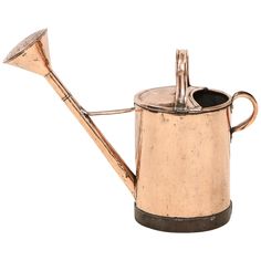 an old metal watering can with a wooden handle