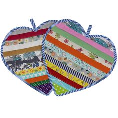 two pieces of fabric in the shape of a heart with different patterns and colors on them