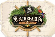 the logo for blackbeards gift shop, with two parrots and a pirate flag