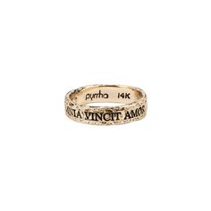 A 14k gold ring engraved with our Omnia Vincit Amor motto. Latin Mottos, Love Conquers All, Antique Wax, Seize The Day, Carbon Neutral, Gold Band Ring, Signature Jewelry, Sustainable Jewelry, Ring Sizes