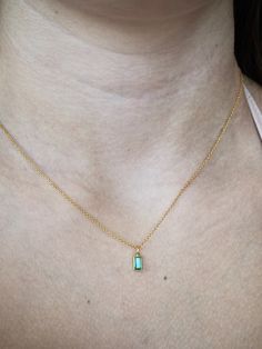 This tiny emerald necklace is the perfect daily necklace for emerald  lovers and May babies! The necklace is 14k gold filled with a beautiful natural Zambian Emerald  pendant in a vivid green color in 18k solid gold setting. So beautiful! Layer it with your favorite necklaces, or wear it alone - it's perfect either way! The pendant is very small, approximately 4x7mm with a 3.5mm emerald. Each stone is unique and there will be slight variations in size. Emerald💚 Through time, the emerald has been known as a symbol of truth and love. In ancient Greece and Rome, emerald was said to be the gemstone of the goddess Venus, purveyor of love and hope. On the other side of the world, emeralds were revered by the Incas and believed by the Egyptians to be a source of eternal life. Emeralds were consi Dainty 14k Gold Emerald Necklace, Dainty 14k Gold Emerald Necklace Gift, Dainty Emerald Necklace For May Birthstone, Dainty Emerald Necklace, Daily Necklace, Symbol Of Truth, Emerald Pendant Necklace, Emerald Necklace Pendant, North Star Necklace