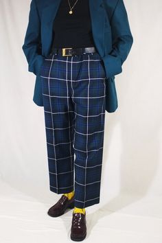 Plaid vintage pants made of pure wool 🦆 Cool and incredibly stylish. Checkered pants are always a delicious accent in looks that attracts the eye and does not have mass appeal. Cool tartan (check) in familiar and pleasing colors. The natural color of young fresh grass, cornflower blue and basic black and white. Create a mood for yourself and let others enjoy your look. Comfortable and up-to-date cut - loose leg, high rise, pockets, belt loops. Pure quality wool is also one of the significant advantages. From the men's wardrobe. Great unisex. 100% wool. The size is not specified. Will fit L. Smaller with a tightened belt, as in the photo. The model in the photo is size M. The belt is 47 cm. Hips 56 cm. Length at outer seam 103 cm, inner seam 73 cm. Front 33 cm, back 41 cm. The width of the Vintage Wool Pants For Formal Occasions, Retro Fitted Wool Bottoms, Vintage Wool Pants For Fall, Fitted Vintage Wool Pants, Formal Plaid Wide Leg Pants, Plaid Wide Leg Formal Pants, Formal Wide Leg Plaid Pants, Vintage Trousers For Winter, Plaid Wide Leg Pants For Formal Occasions