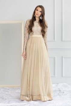 Model: 5'8 - 176 cm and 117 lbs - 53 kg size S Mars -a grandeur in ivory beige is a formal must-have. This stunning long maxi dress features the skill of sequins and zari artisan in a classic light gold jacket that sparks the elegance. The chiffon hemline flaunts with shamus silk border and belt details make the dress an epitome of regality. Mars is your pick to enchant your magic and be effortlessly stylish. Dress: Color: Beige   Fabric: Net and chiffon  Long maxi with embroidered bodice  Cut-dana embroidery  Cotton silk lining inside     Full semi-sheer sleeves  Shamooz silk belt and border Formal Full-length Cream Dress, Formal Full Length Cream Dress, Cream Full-length Formal Dress, Elegant Festive Maxi Dress, Sequined Maxi Dress For Wedding, Festive Floor-length Maxi Dress For Evening, Festive Maxi Length Evening Dress For Gala, Festive Maxi Length Gown For Gala, Festive Maxi Evening Dress For Gala