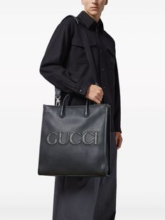 black leather grained texture embossed logo to the front GG Supreme canvas two rolled top handles adjustable detachable shoulder strap hook fastening main compartment internal zip-fastening pocket This item is in size UNI and the color is Black Gucci Top Handle Bag With Logo, Gucci Top Handle Bag With Branded Hardware, Gucci Bags With Branded Hardware For Daily Use, Gucci Tote Bag With Branded Hardware, Gucci Shoulder Bag With Logo Hardware, Gucci Shoulder Bag With Logo Hardware For Business, Gucci Double Handle Satchel For Daily Use, Gucci Shoulder Bag With Top Carry Handle, Modern Gucci Bag With Branded Hardware