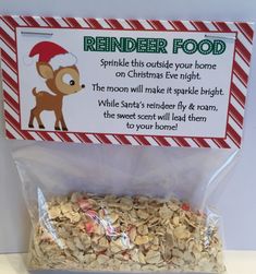 reindeer food in a bag on a table with candy canes and an elf's hat