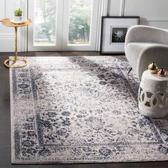 a white and blue rug in a living room