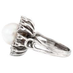 The ring is finely crafted in 14k white gold with center pearl and diamonds weighing approximately total of 1.00 carat. Circa 1950. Antiques Value, Pearl And Diamond Ring, Pearl Diamond, The Ring, Ring Verlobung, Diamond Rings, Jewelry Rings, Silver Rings, Wedding Rings