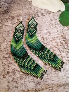 Green Fringe Jewelry For Festivals, Green Fringe Jewelry For Festival, Green Beaded Earrings For Festival, Green Tassel Drop Earrings As Gift, Adjustable Green Tassel Earrings, Adjustable Green Jewelry With Tassels, Green Beaded Long Drop Jewelry, Green Long Drop Jewelry With Dangling Beads, Bohemian Green Long Drop Earrings