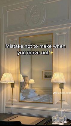 a room with a mirror and two lamps on the wall next to it that says, make not to make when you move out