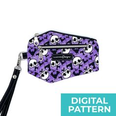 a purple and black purse with skulls on it