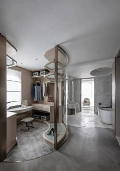 a modern bathroom with curved glass shower and marble flooring, along with an oval shaped bathtub