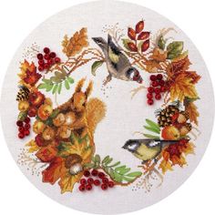 a cross stitch pattern with birds and autumn leaves in the shape of a wreath on a white background