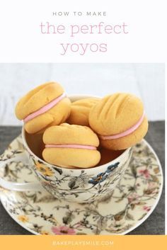 some cookies are in a cup on a saucer