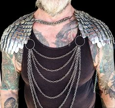 This bold scalemail armor and chainmail body chain shoulder armor spaulders set is perfect for any snake, fairy, mermaid, or dragon cosplay or viking costume, or for Renaissance Fair,  outfits, weddings, or music festivals or concert outfits. With adjustable neck and back straps, you'll be ready to conquer whatever adventure you choose. THIS IS NO ORDINARY SCALEMAIL TOP! IT IS PREMIUM CHAINMAIL CRAFTED BY A SKILLED ARTISAN IN CANADA! Fashioned from top-grade stainless steel rings and chains and Scalemail Armor, Chainmaille Patterns, Dragon Cosplay, Outfit Corset, Chainmail Armor, Rave Costume, Dragon Fairy, Scale Mail, Viking Dragon